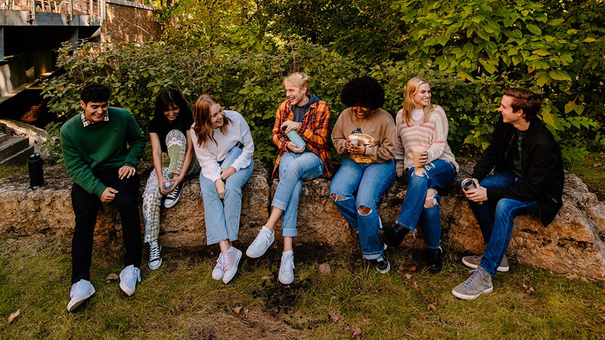 group of students sitting outside