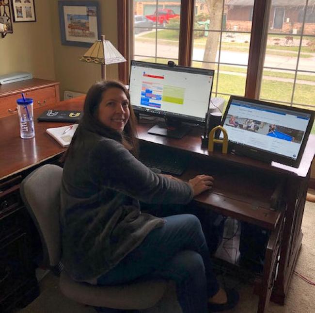 Rachel using dual monitors to work hard while looking out her big window