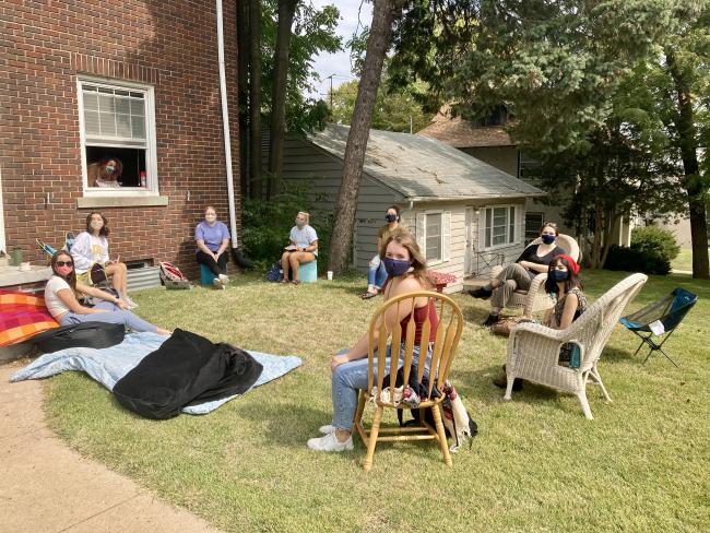 students gathered outside their classmates residence hall