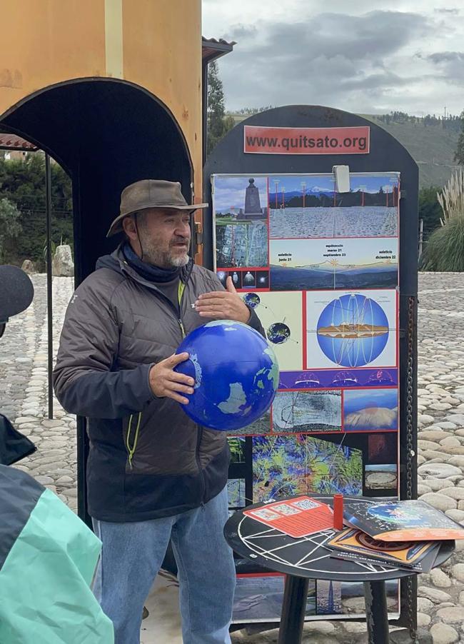 Guide in Ecuador explaining how maps are drawn.