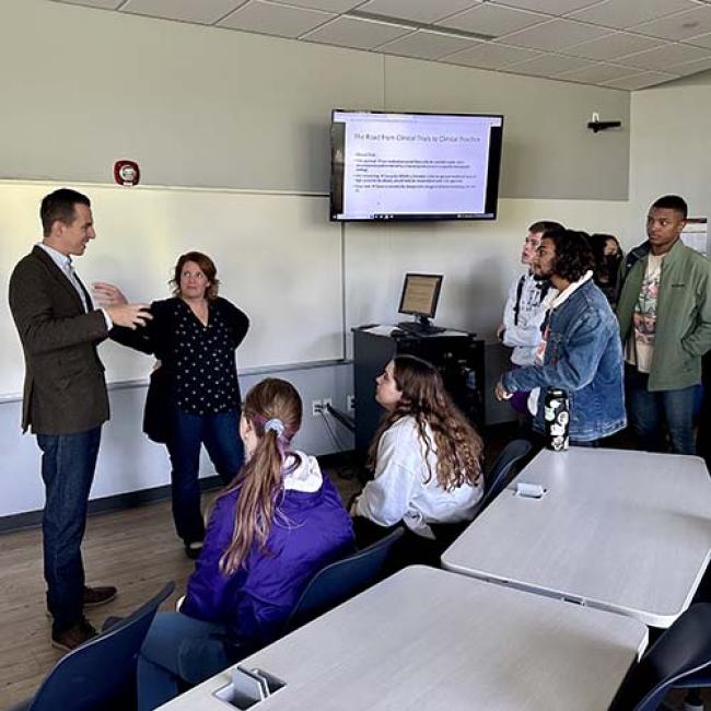 Dr. Shara Stough and Dr. Austin Williamson speak with students.