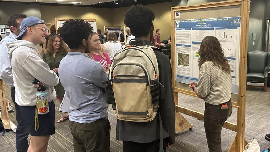 Students at a poster presentation