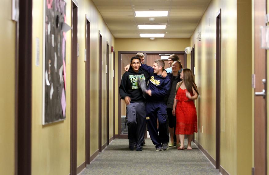 Augustana friends walking up the hallway