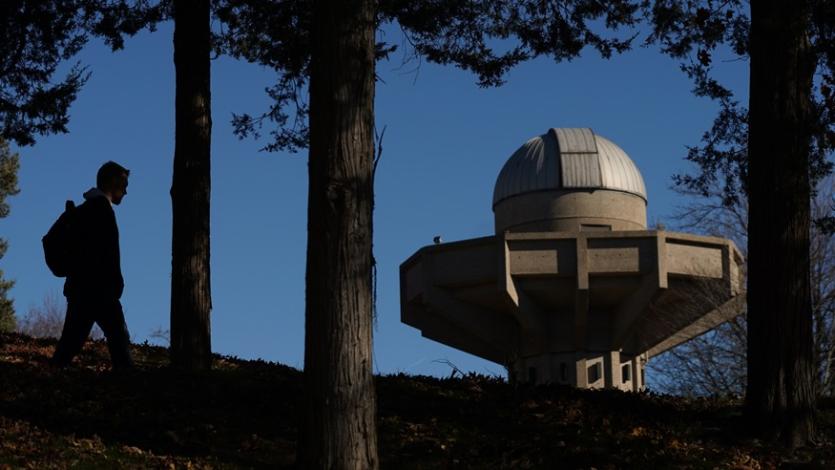 Student walking near planetarium